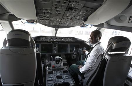 Kebede, an Ethiopian Airlines manager, sits inside the cockpit of their 787 Dreamliner after it arrived at the Jomo Kenyatta international airport in Kenya’s capital Nairobi