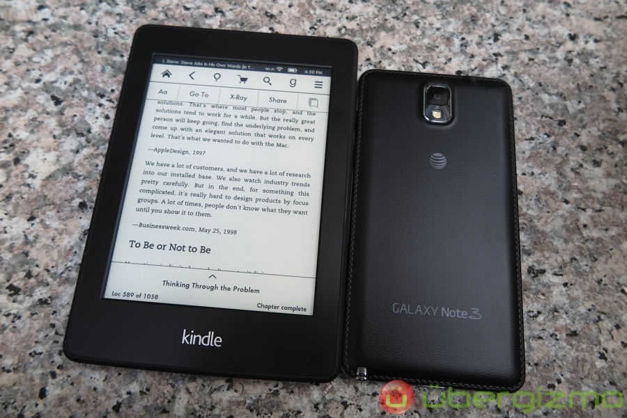 Side-by-side comparison between Kindle Paperwhite (left) and Samsung Galaxy Note 3 (right).